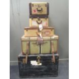 A mid 20th century travel trunk together with a travelling canvas and leather bound trunk,