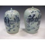 Two blue and white lidded vases, tallest 32.5cm