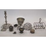 An early 20th century small silver taper stick, a small toast rack and other items