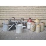 Four watering cans and various stoneware items (9)