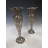 A pair of unmarked white metal vases, tests as silver, of probable foreign origin, 28cm high 28.8ozt