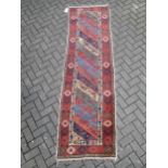 A Persian runner with stripy field 268 x 79cm