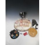 A collection of miniature bisque and other dolls, beadwork bags and purses, a collapsible top hat