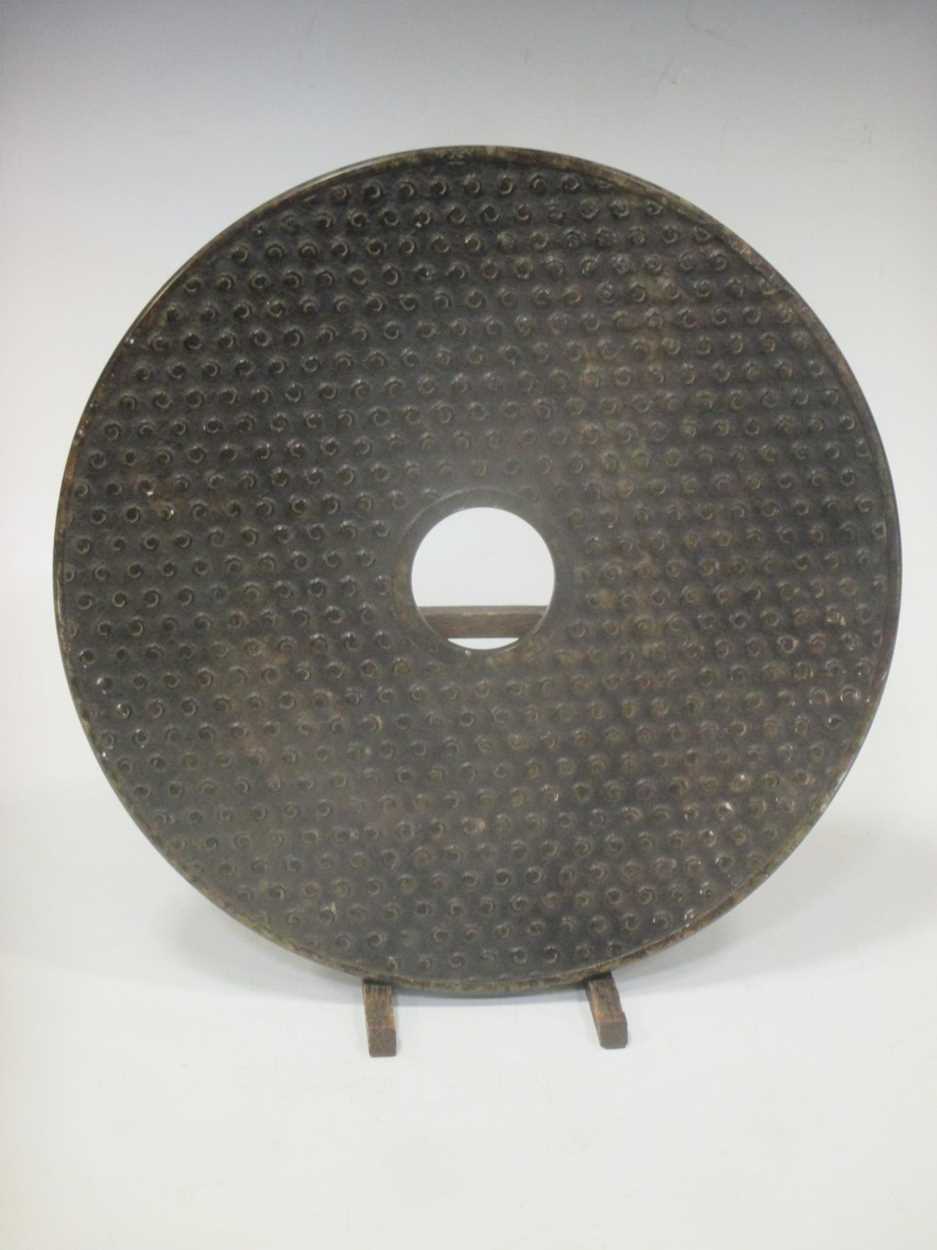 A large Chinese soapstone Bi Disc, 30cm diameter