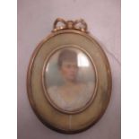 A Victorian portrait miniature memorial pendant in an unmarked frame testing to at least 9ct gold (