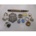 A collection of jewellery including a nurses buckle, a pair of butterfly wing ear pendants, a pair