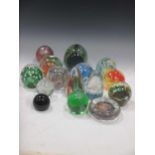 Thirty modern glass paperweights