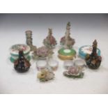 A group of English porcelain, small floral encrusted bottles and three porcelain jars and covers and