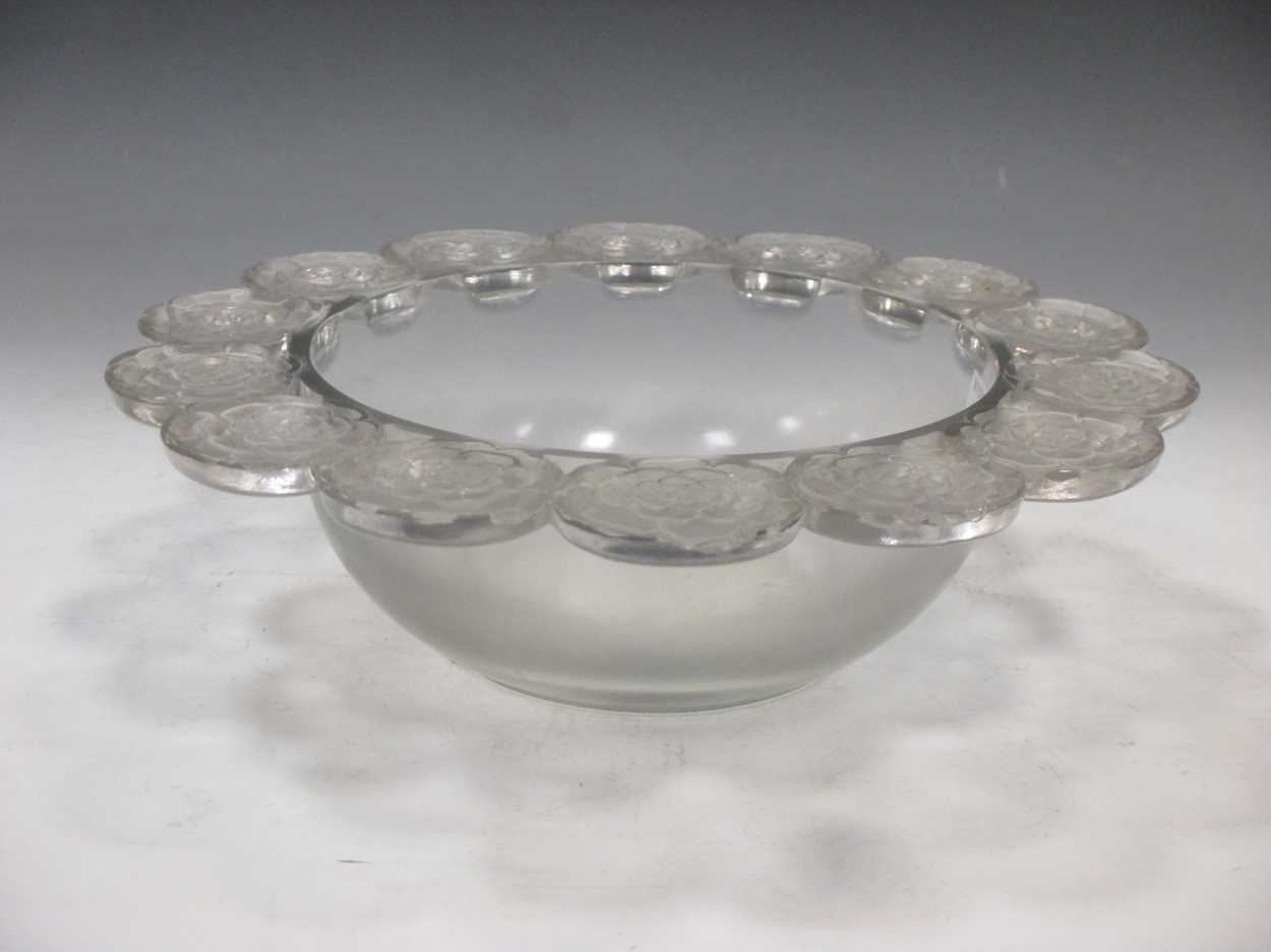 A Lalique glass bowl with repeating flower head border 27cm diameterFootnote: Provenance: Julians