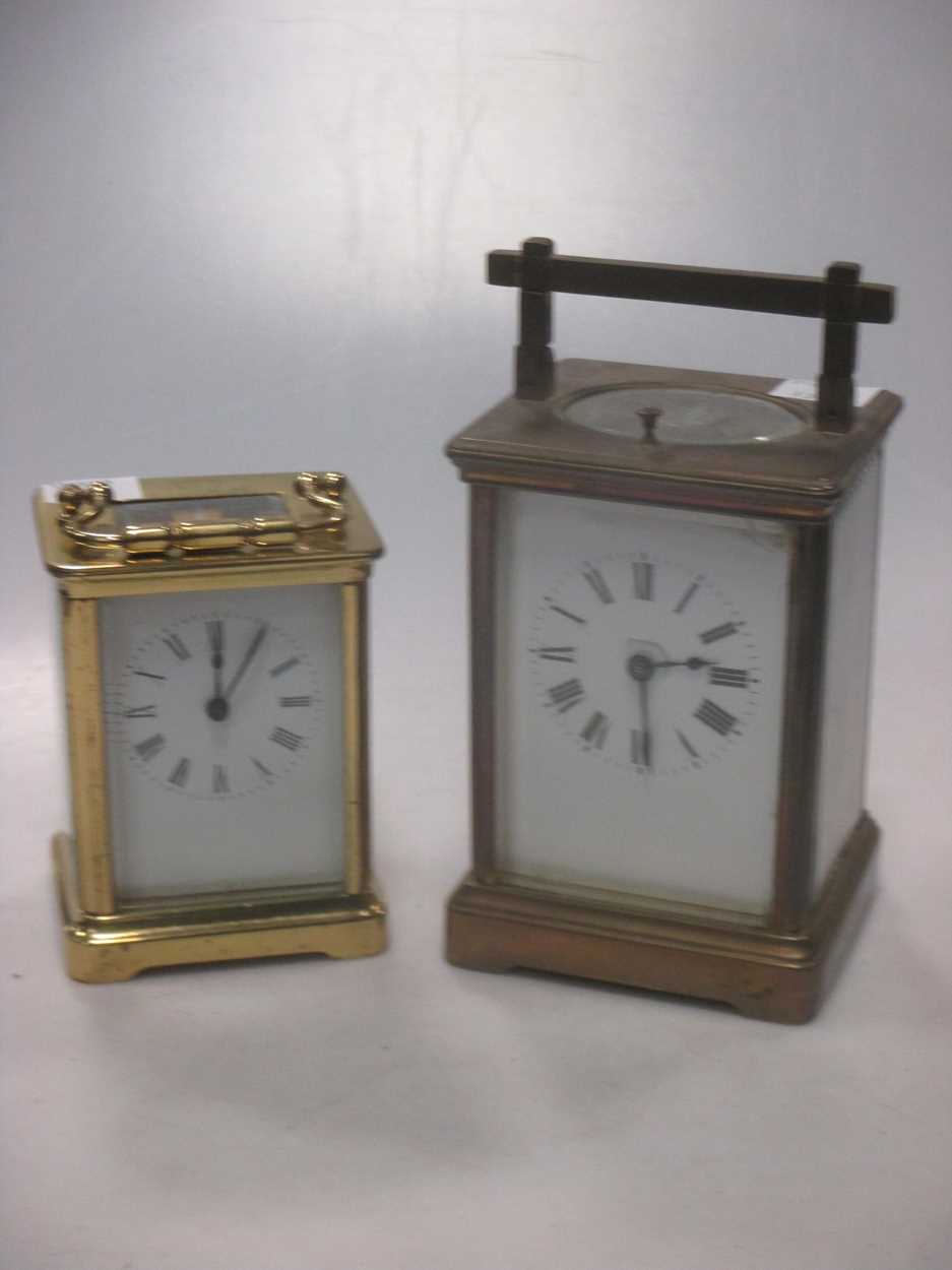 An Edwardian brass carriage clock, 13cm high and a mid 20th century carriage clock (2)Footnote: