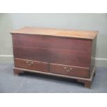 An oak mule chest, the hinged lid above two drawers on bracket feet 68.5 x 118 x 46.5cm