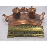 An Art Nouveau copper ink stand, together with another brass inkwell (2)