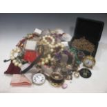 A bag containing a large collection of costume jewellery