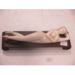 An early 20th century ivory doctors model of a reclining female, possibly Tokyo school, 22cm long,