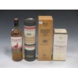 A bottle of Dalwhinnie Scotch Whiskey 15 years, Glenmorangie portwood finish, Bushmills malt 21 Rare