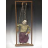 An early 20th century Japanese figure puppet within a wooden frameCondition report: Dimensions