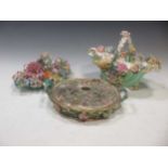 A group of 19th century floral encrusted English proclain to include two baskets and pot pourri