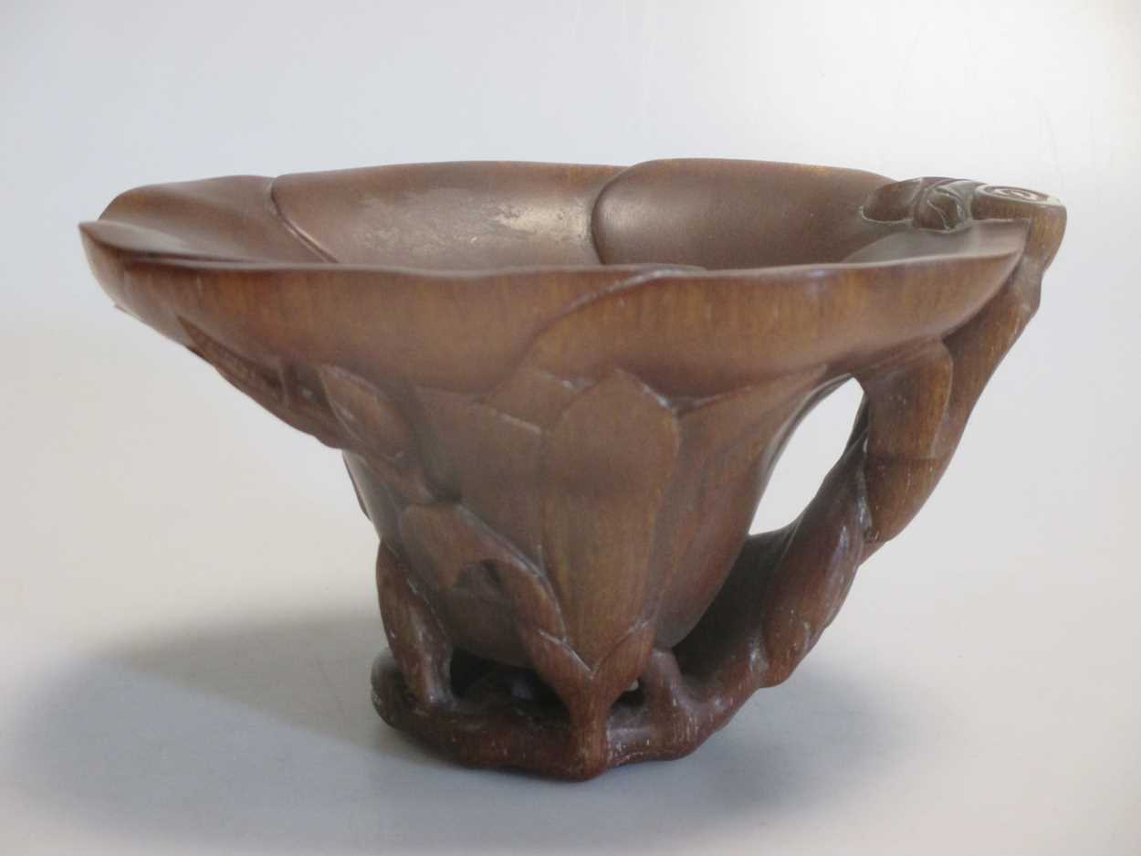 .A Chinese resinous libation cup, with naturalistic floral decoration, 9cm highCondition report:
