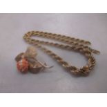 A hallmarked 9ct gold rope chain together with a hallmarked 9ct gold coral brooch (2)