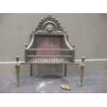 A Victorian fire grate with brass finials 67cm high and 65.5cm wide