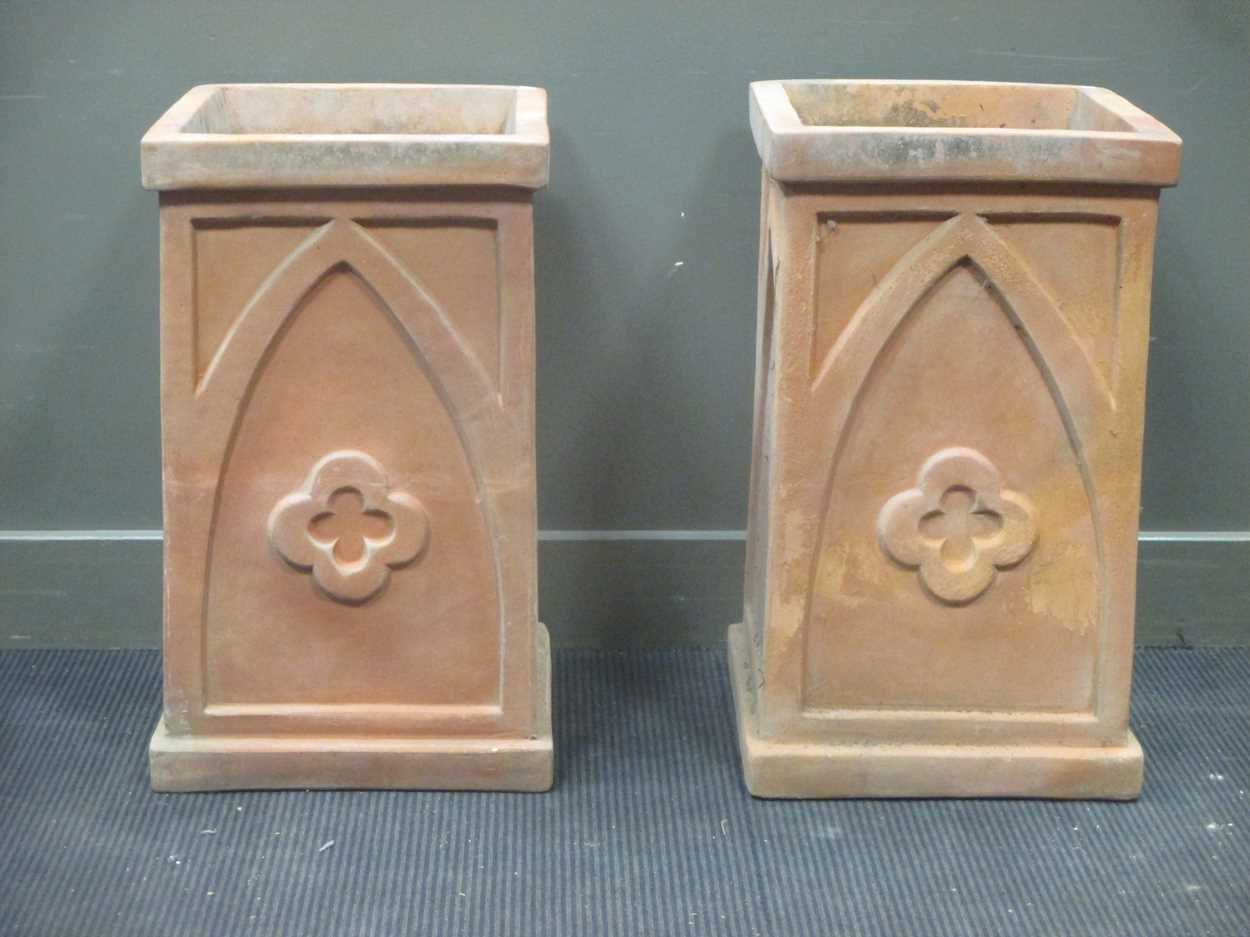 A near pair of terracotta planters decorated with gothic arches and quatrefoil 70.5 x 41 x 43cm