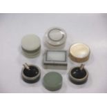 A snuff box with a mother of pearl lid together with four various hardstone boxes and a pair of