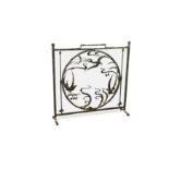 An early 20th century wrought iron fire screen,
