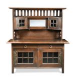 An Arts & Crafts oak sideboard in the manner of Liberty & Co.,