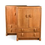Fyne Ladye for Heal's, a pair of oak Odeonesque tallboys,