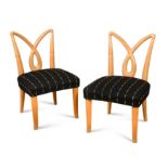A pair of Mid-Century blonde wood side chairs,