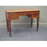 A late Victorian mahogany side table, the rectangular top above four drawers on ring turned legs