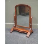 A Victorian mahogany dome top dressing table mirror 74 high and 56cm wide