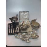A collection of silverware including flatware, sauceboats, milk jugs and sugar bowl, a set of silver