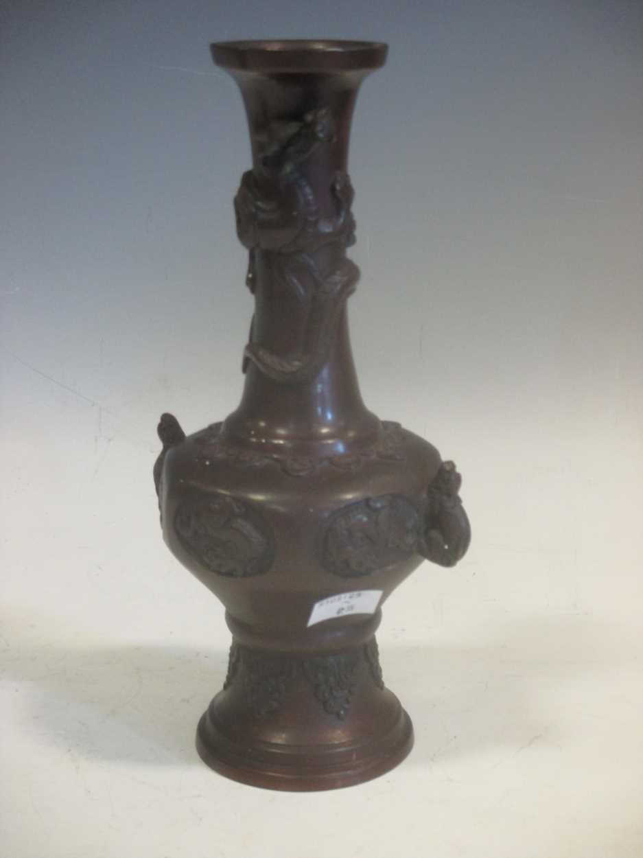 An Antique 19th century Japanese Meiji period bronze vase in high relief, 24cm high