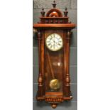 A 19th century walnut case twin weight Vienna wall clock, with later pediment, 120cm high