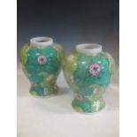 A Pair of Chinese famille rose baluster vases, decorated with lillies and radiating flowers, 31cm