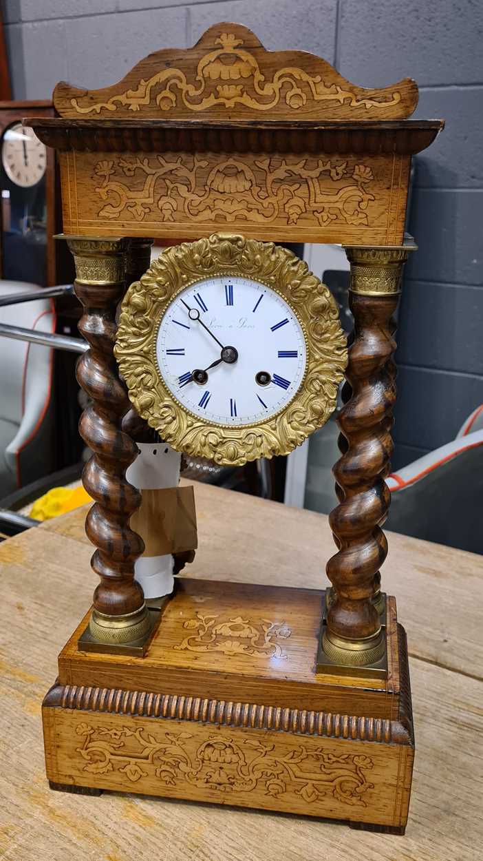 A French portico clock, 19th century, inlaid walnut case with painted dial, bell striking