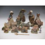 Four Lladro figurines of farm girls, five Caithness paperweights and nine Lilliput Lane cottages