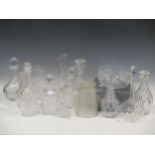 A collection of cut glass decanters and jugs, and a Waterford bowl