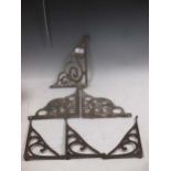 A collection of various iron wall shelf brackets