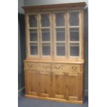 A stripped/waxed pine glazed top cabinet, 20th century, fitted with drawers and cupboards, 223 x 155