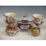 A pair of early Victorian blue and gilt porcelain urns with floral panels (repaired), a sucrier, a