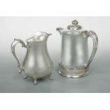 Two American early 20th century silver plated water jugs, one open, the other lidded and lined (2)