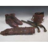 Two brass inlaid flintlock pistols, together with a pair of leather cased field binoculars and