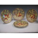A group of Royal Worcester porcelain painted with peaches, etc. by J Smith and two painted cabinet