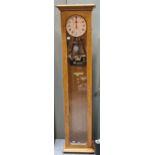 Gillett and Johnston electric master clock, in pale oak case, 141cm high
