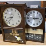 ATO by Junghans electric wall clock, 47cm high, and a Seiko electric wall clock of similar design (