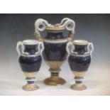 A garniture of three blue, white and gilt vases of ovoid form with entwined serpent handles (3)