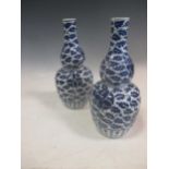 A Pair of Chinese blue and white porcelain gourd vases, Qing Dynasty c 1880, painted with