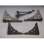 A collection of various iron wall shelf brackets